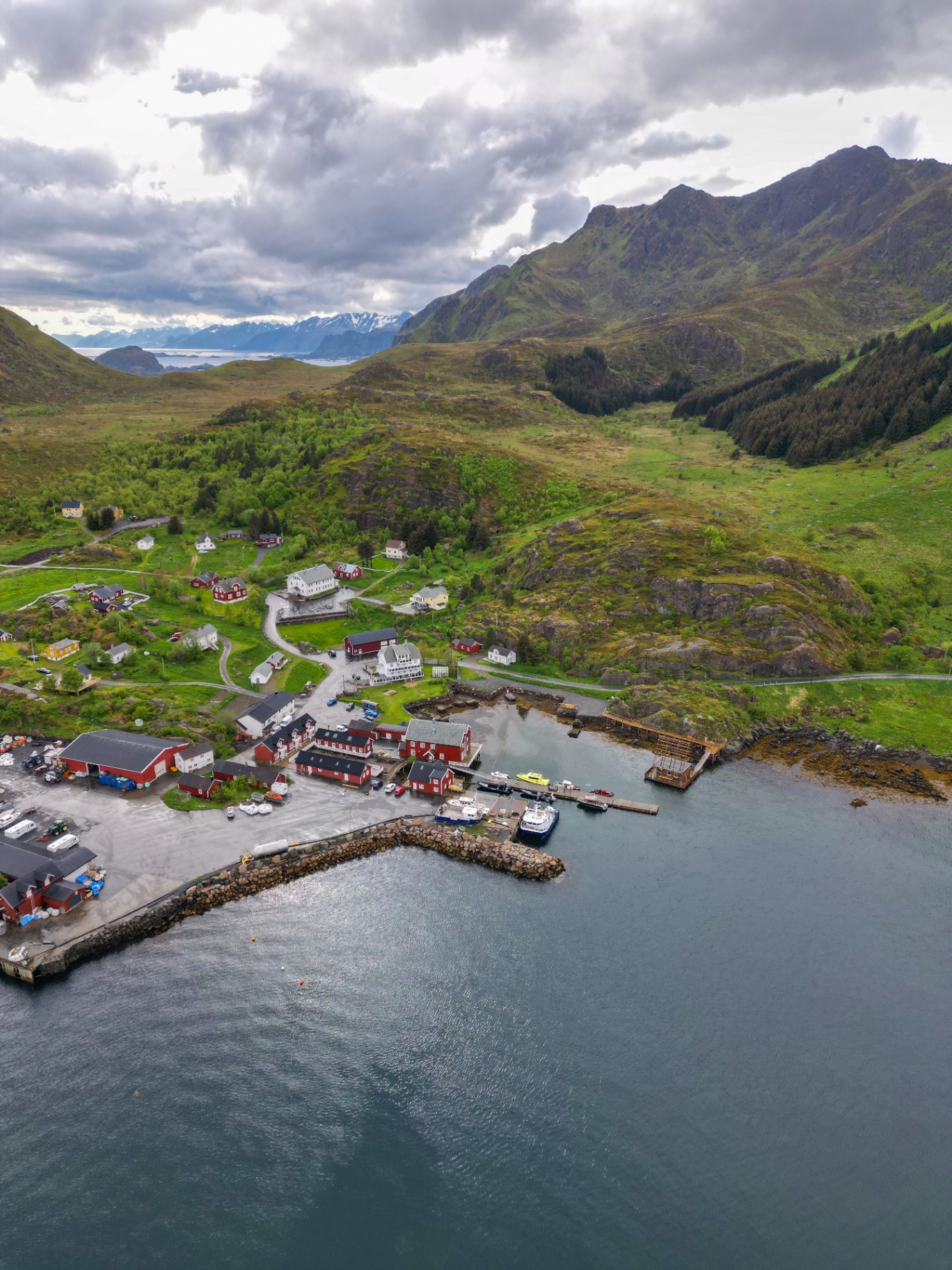 Aerial view of URE harbour between green mountains and the sea